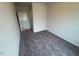 Neutral bedroom featuring soft carpet, neutral walls, and a nearby door at 106 E Victory View. Ter, Smithfield, NC 27577