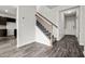 Inviting entryway featuring vinyl flooring and a staircase with wood handrail at 106 E Victory View. Ter, Smithfield, NC 27577