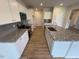 Kitchen island featuring granite countertops, stainless steel appliances and plenty of cabinet space at 106 E Victory View. Ter, Smithfield, NC 27577