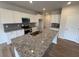 Kitchen island with granite countertops and white cabinets at 106 E Victory View. Ter, Smithfield, NC 27577
