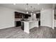The stylish kitchen features modern cabinetry, stainless steel appliances, and a center island with pendant lighting at 106 E Victory View. Ter, Smithfield, NC 27577
