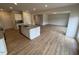 Open-concept kitchen with island flows into living space, features hardwood floors at 106 E Victory View. Ter, Smithfield, NC 27577