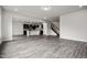Spacious open-concept living area with vinyl flooring seamlessly connecting to the kitchen and staircase at 106 E Victory View. Ter, Smithfield, NC 27577