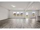 Spacious living room featuring plenty of natural light with vinyl flooring throughout the open area at 106 E Victory View. Ter, Smithfield, NC 27577