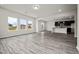 Open-concept living area showcasing vinyl flooring and a seamless transition to the kitchen at 106 E Victory View. Ter, Smithfield, NC 27577