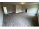 Bright, open concept living area with neutral carpet, multiple windows, and recessed lighting at 106 E Victory View. Ter, Smithfield, NC 27577