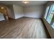 Bright and airy living room featuring wood-look flooring and natural light at 106 E Victory View. Ter, Smithfield, NC 27577