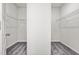 A bare walk-in closet featuring carpet flooring and metal shelving at 106 E Victory View. Ter, Smithfield, NC 27577