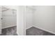 Spacious, bare walk-in closet with carpet flooring and metal shelving at 106 E Victory View. Ter, Smithfield, NC 27577