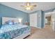 Bedroom featuring a bed with colorful bedding and a ceiling fan at 1079 Vauxhall Dr, Apex, NC 27502