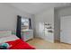 Bedroom with a bed, wooden floors, a window, a dresser with drawers and a door at 115 Rocky Branch Ct, Garner, NC 27529