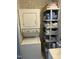 Convenient laundry area with stackable washer and dryer and adjacent storage shelves at 117 Lone Star Dr, Louisburg, NC 27549