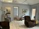 Cozy living room featuring tile floors, and a view into the bedroom at 117 Lone Star Dr, Louisburg, NC 27549