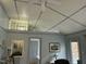 Bright living room featuring tile floors, high ceilings, and a ceiling fan at 117 Lone Star Dr, Louisburg, NC 27549