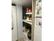 Pantry with white rotating shelves and convenient storage for groceries and kitchen supplies at 117 Lone Star Dr, Louisburg, NC 27549