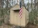 Storage shed displaying an American Flag at 117 Lone Star Dr, Louisburg, NC 27549