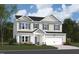 Charming two-story home featuring a combination of siding and brick, complemented by green shutters and a two-car garage at 1225 Dimaggio Dr # 9, Raleigh, NC 27616