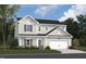 Charming two-story home featuring a white garage door, light siding and a well manicured front lawn at 1228 Dimaggio Dr # 32, Raleigh, NC 27616