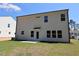 A newly constructed home featuring a spacious backyard with a small patio, perfect for outdoor entertaining at 1229 Dimaggio Dr # 8, Raleigh, NC 27616