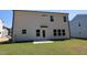A newly constructed home featuring a spacious backyard with a small patio, perfect for outdoor entertaining at 1229 Dimaggio Dr # 8, Raleigh, NC 27616