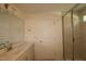 Bathroom featuring modern vanity with marble countertops, shower with glass door and tiled walls at 1229 Dimaggio Dr # 8, Raleigh, NC 27616