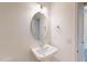 Bathroom featuring a modern sink, oval mirror, and updated fixtures at 1229 Dimaggio Dr # 8, Raleigh, NC 27616