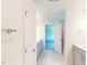 Modern bathroom featuring a double vanity, white tile floors, and glass enclosed shower at 1229 Dimaggio Dr # 8, Raleigh, NC 27616