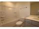 Bathroom with a shower-tub combo, white toilet, and single sink vanity at 1229 Dimaggio Dr # 8, Raleigh, NC 27616