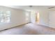 Bedroom showcasing carpet floors, recessed lighting, two large windows, and an ensuite bathroom at 1229 Dimaggio Dr # 8, Raleigh, NC 27616