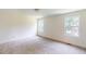 Bedroom showcasing carpet floors, recessed lighting, and two large windows providing ample natural light at 1229 Dimaggio Dr # 8, Raleigh, NC 27616