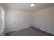 Bedroom featuring two doors, neutral-toned walls, carpeted floor and a sunny window at 1229 Dimaggio Dr # 8, Raleigh, NC 27616
