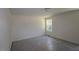 Bedroom with neutral walls, ceiling light and a sunny window at 1229 Dimaggio Dr # 8, Raleigh, NC 27616