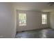 Bedroom featuring two sunny windows and neutral-toned walls at 1229 Dimaggio Dr # 8, Raleigh, NC 27616