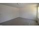 Bedroom with neutral walls, ceiling light and a sunny window at 1229 Dimaggio Dr # 8, Raleigh, NC 27616