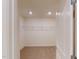 Walk-in closet features wire shelving and neutral carpeting at 1229 Dimaggio Dr # 8, Raleigh, NC 27616