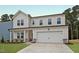 Charming two-story home with white siding, stone accents and a two car garage at 1229 Dimaggio Dr # 8, Raleigh, NC 27616