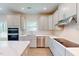 Modern kitchen featuring an island, stainless steel appliances and white cabinets at 1229 Dimaggio Dr # 8, Raleigh, NC 27616