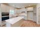Bright kitchen featuring stainless steel appliances, quartz countertops, and a kitchen island at 1229 Dimaggio Dr # 8, Raleigh, NC 27616