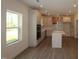 Modern kitchen featuring an island with white countertops, stainless steel appliances, recessed lighting, and wood floors at 1229 Dimaggio Dr # 8, Raleigh, NC 27616
