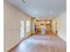 Bright kitchen featuring white cabinets, a large island, stainless steel appliances, hardwood floors, and a patio door at 1229 Dimaggio Dr # 8, Raleigh, NC 27616
