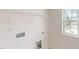 Laundry room featuring hookups, shelving, and a bright window at 1229 Dimaggio Dr # 8, Raleigh, NC 27616