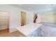 An open floor plan featuring a kitchen island and a view of the living room and staircase at 1229 Dimaggio Dr # 8, Raleigh, NC 27616