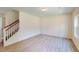 Living room featuring hardwood floors, recessed lighting, a staircase, and a large window providing ample natural light at 1229 Dimaggio Dr # 8, Raleigh, NC 27616