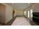 A spacious living room featuring hardwood floors, recessed lighting, and a staircase leading to the upper level at 1229 Dimaggio Dr # 8, Raleigh, NC 27616
