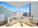 View of the back porch showing the railing and multiple homes at 1250 Barreto Dr, Wendell, NC 27591