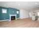 Open-concept living area with a fireplace and seamless flow into the kitchen space with modern flooring at 1250 Barreto Dr, Wendell, NC 27591