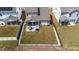 Aerial view of the backyard featuring a patio, grill, and fence, providing a private outdoor space at 1311 Arena Ln, Fuquay Varina, NC 27526
