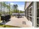 Backyard patio featuring a grill and dining area with umbrella at 1311 Arena Ln, Fuquay Varina, NC 27526