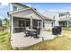 Backyard patio featuring a grill and dining area with umbrella at 1311 Arena Ln, Fuquay Varina, NC 27526