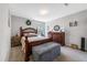 Comfortable bedroom with a wooden bed frame, dresser, and natural light, offering a relaxing retreat at 1311 Arena Ln, Fuquay Varina, NC 27526